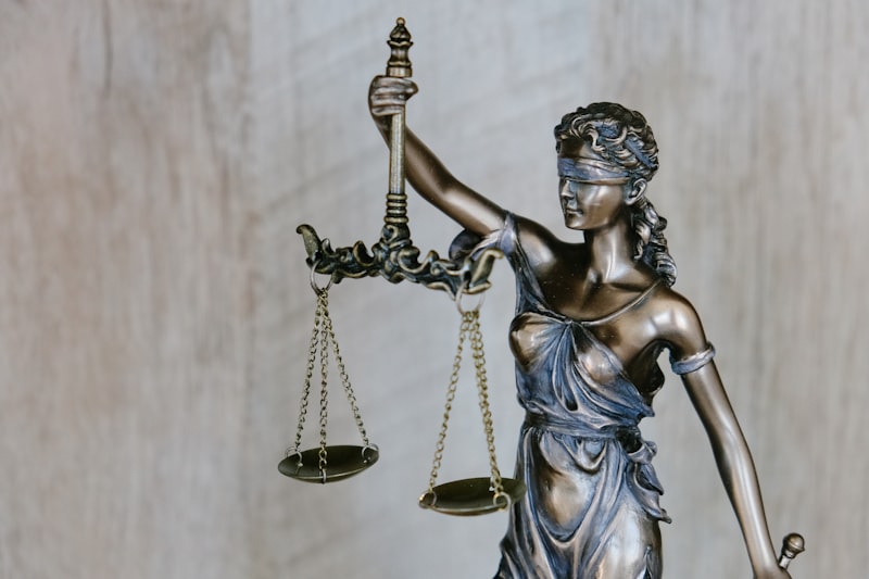 Law books and gavel with technology